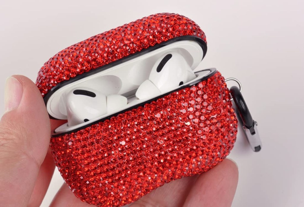 holding a sparkly red AirPods case