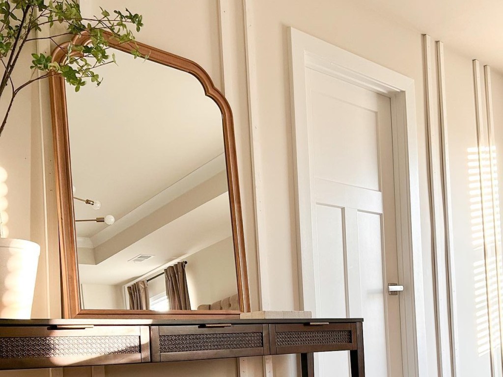 mirror propped on console table