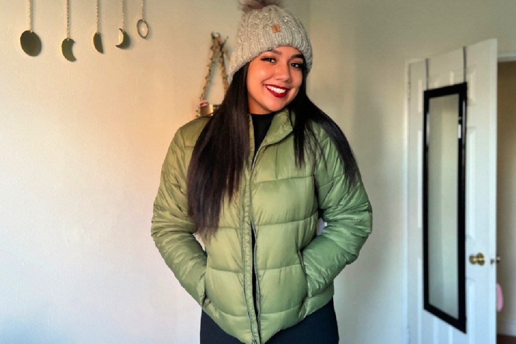 woman in a green puffer jacket