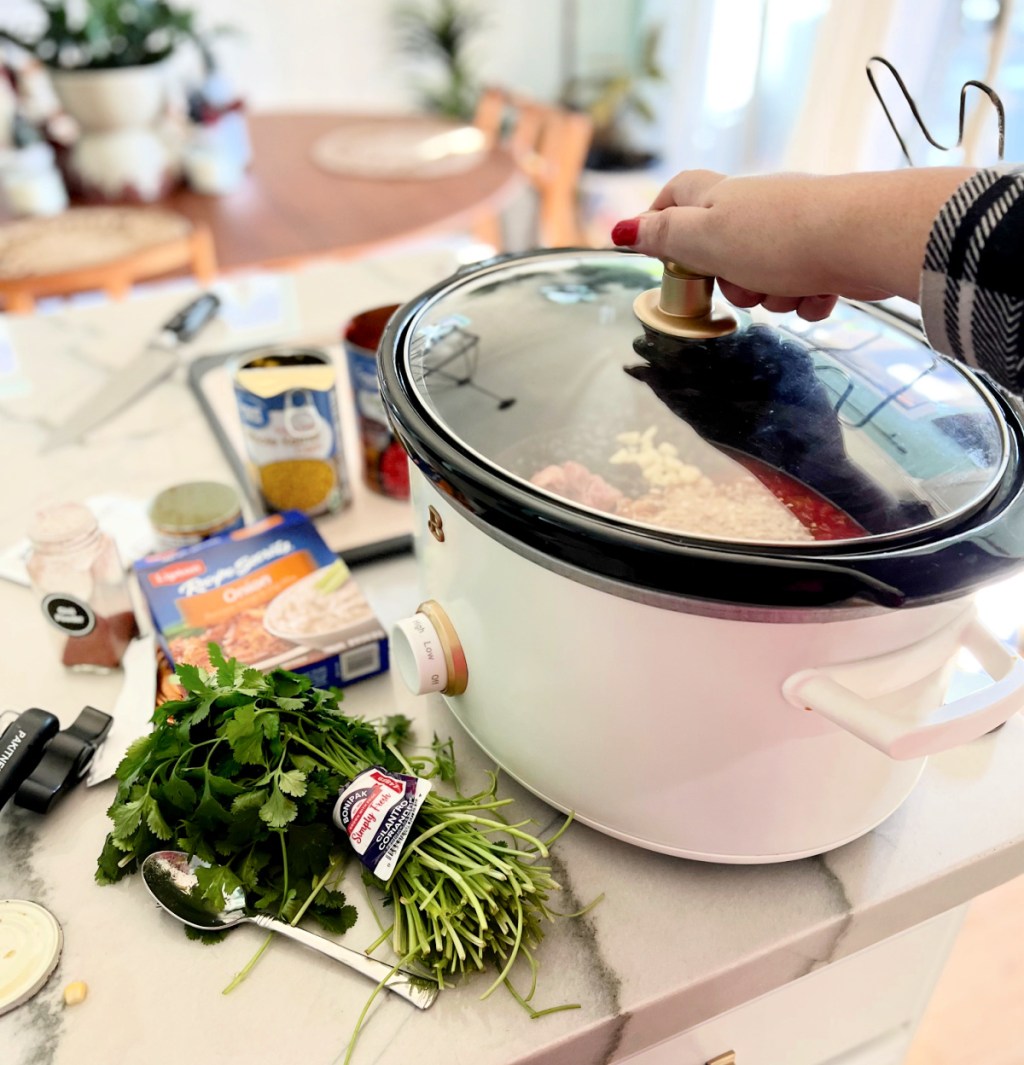 using beautiful by drew barrymore slow cooker to make a meal