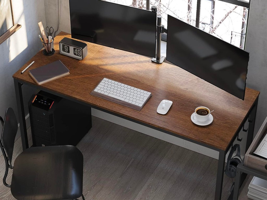 brown and black computer desk with two monitors on top