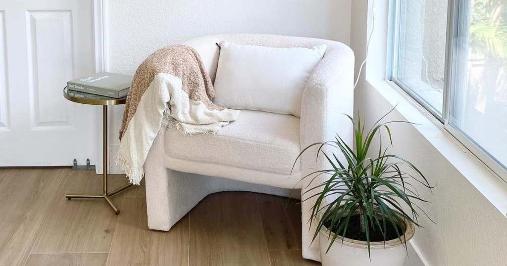 white chair next to potted plant