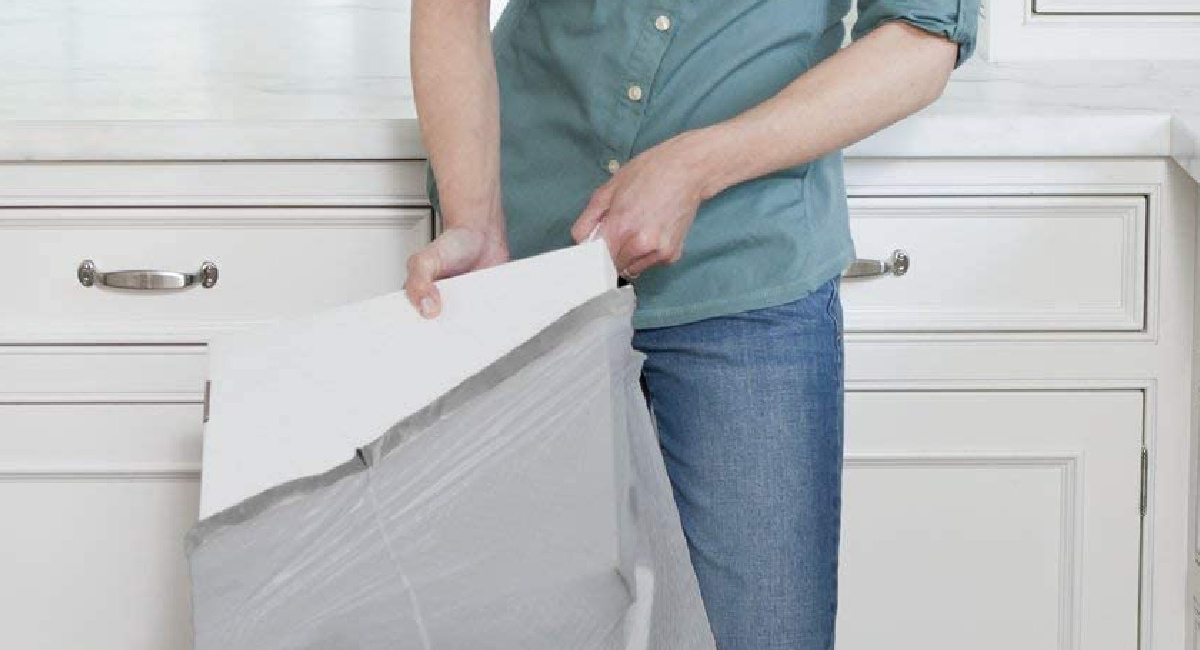 https://hip2save.com/wp-content/uploads/2022/12/woman-using-GLAD-ForceFlexPlus-Tall-Kitchen-Trash-Bags-.jpg?fit=1200%2C650&strip=all