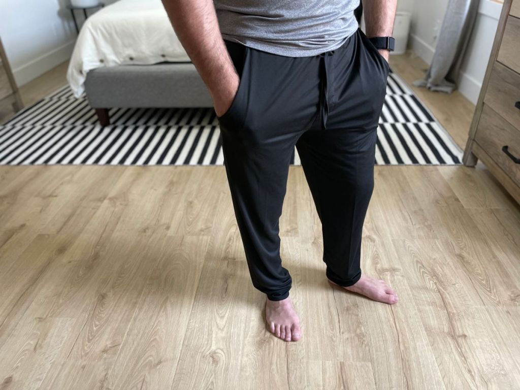 man standing with his hands in his pants pockets