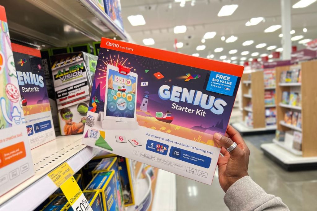 OSMO Genius Starter Kit in woman's hand in aisle at Target
