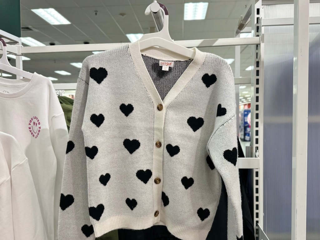 Button front cardigan with black hearts