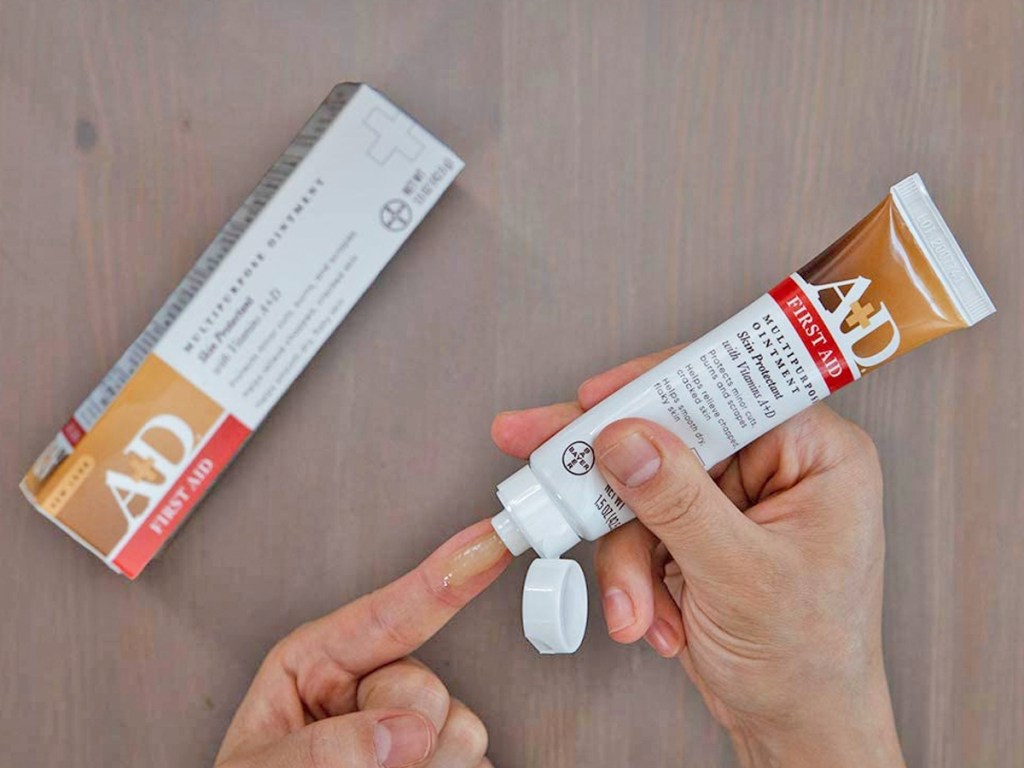 squeezing A+D First Aid Ointment onto finger