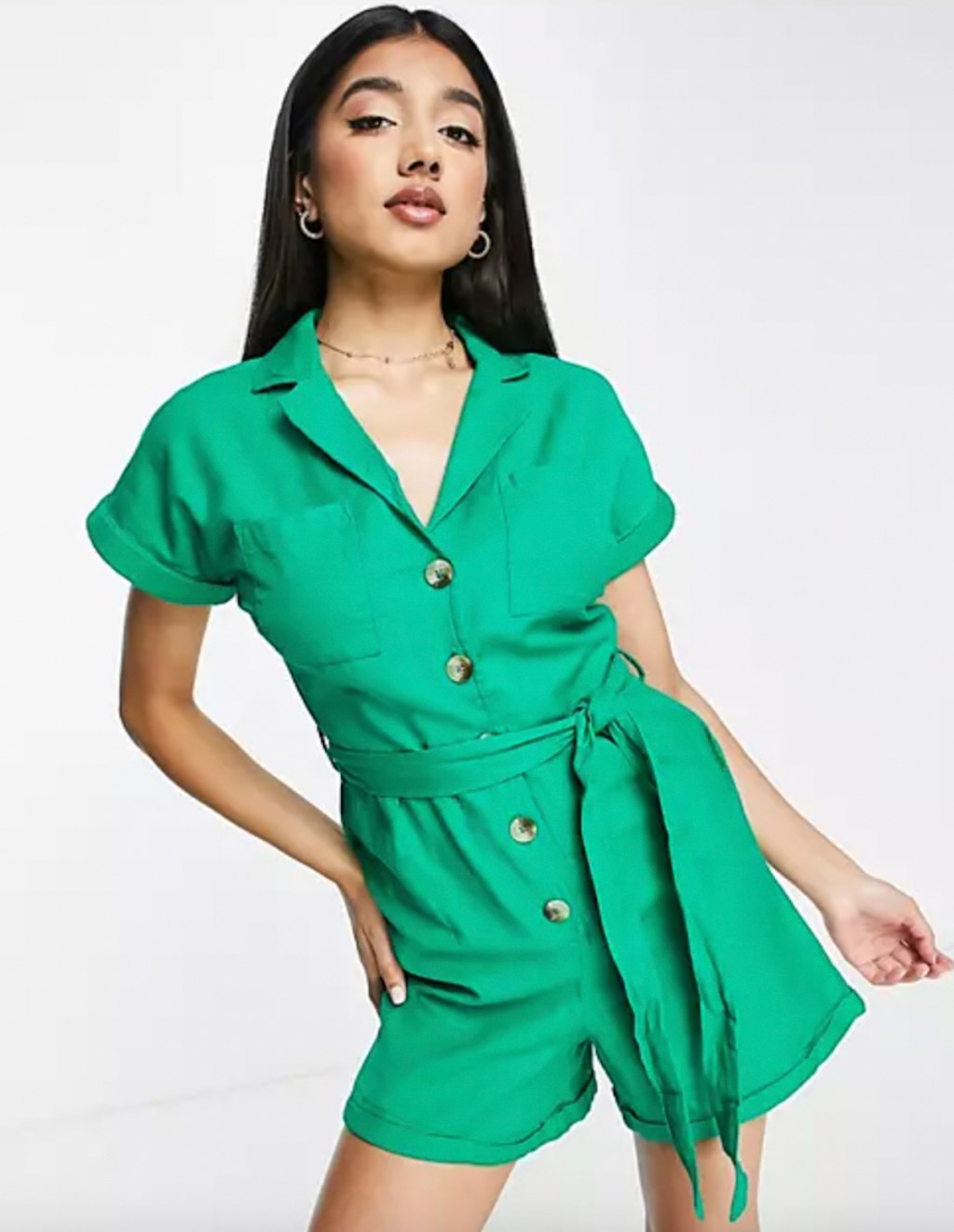 stock photo of woman wearing bright green utility romper
