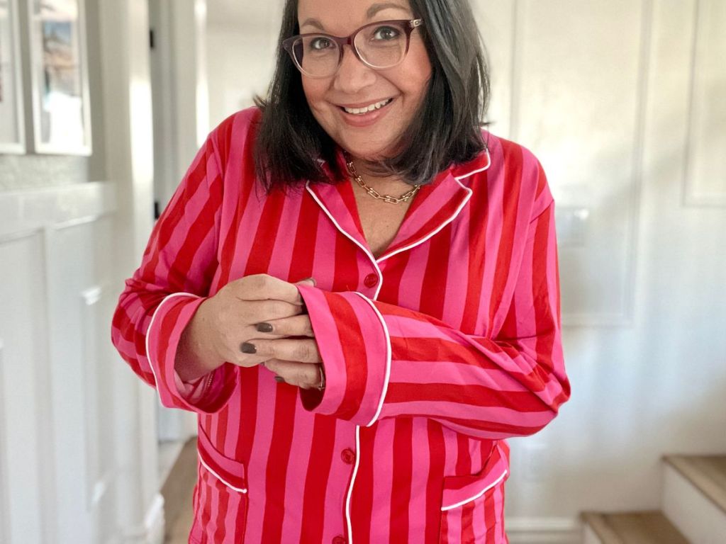 woman showing the sleeve on her striped pajamas