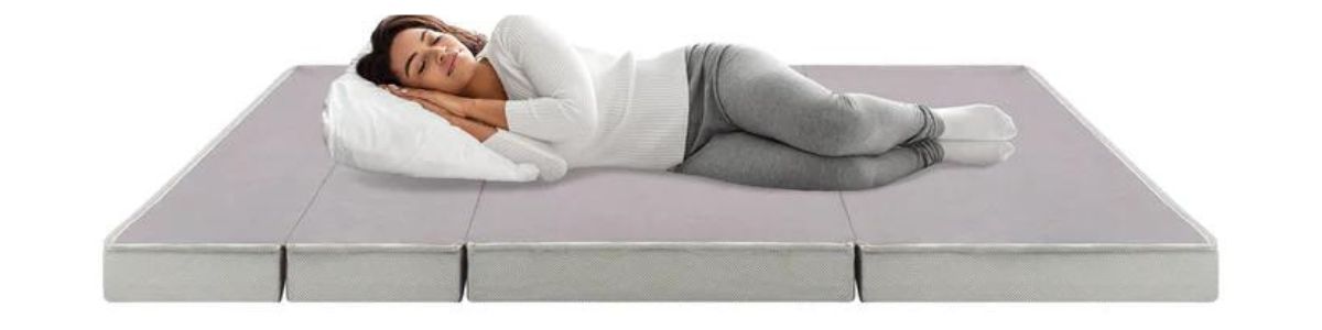 woman sleeping on portable mattress