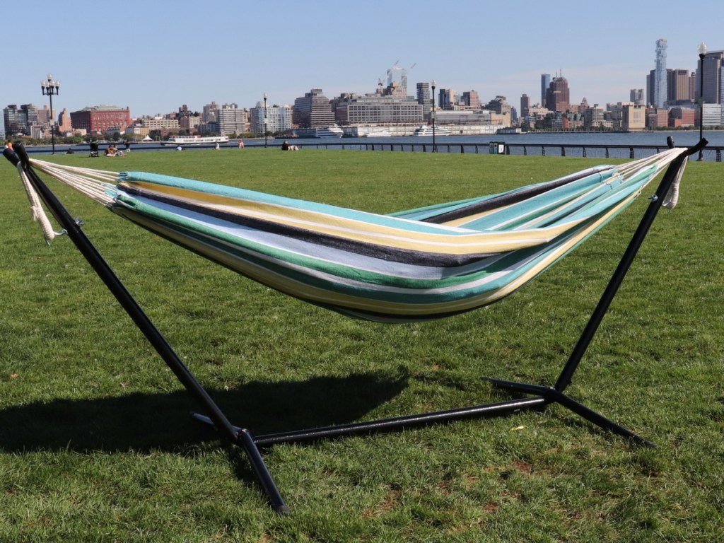 Bliss hammock on a 9ft stand outside on the grass