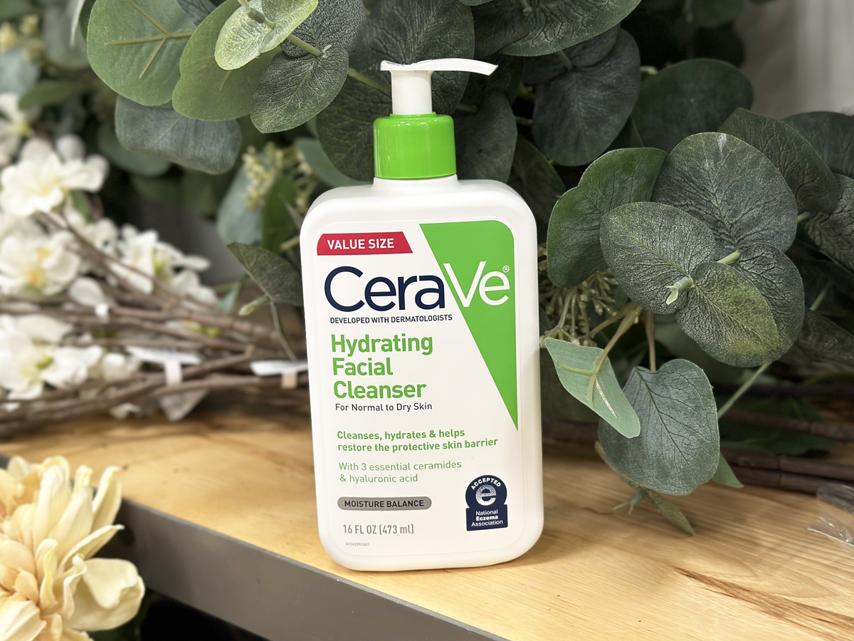 Bottle of CeraVe Facial Cleanser on wood shelf