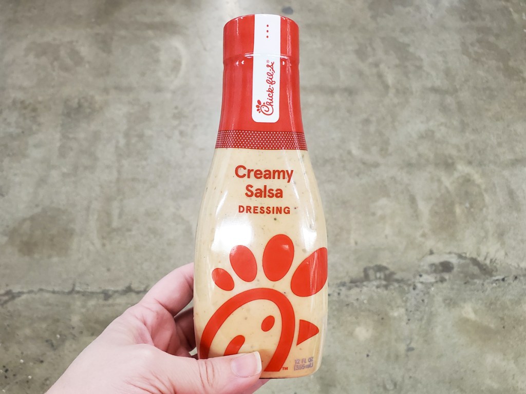 hand holding a bottle of Chick-Fil-A Salad Dressing