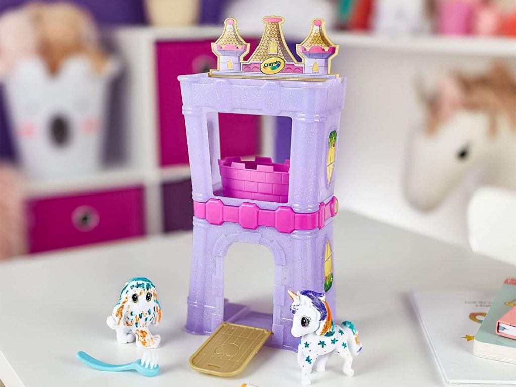 purple palace set with toy unicorns