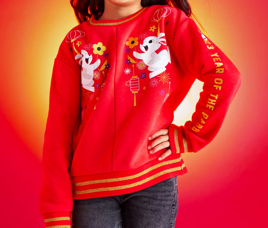 girl in red disney sweatshirt