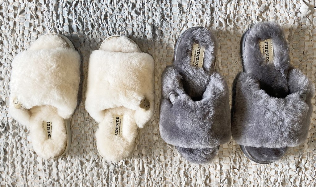white and grey pairs of slipper slides on rug