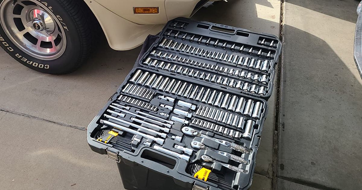 Dewalt mechanics tool set 192 pieces next to a car in a drive way