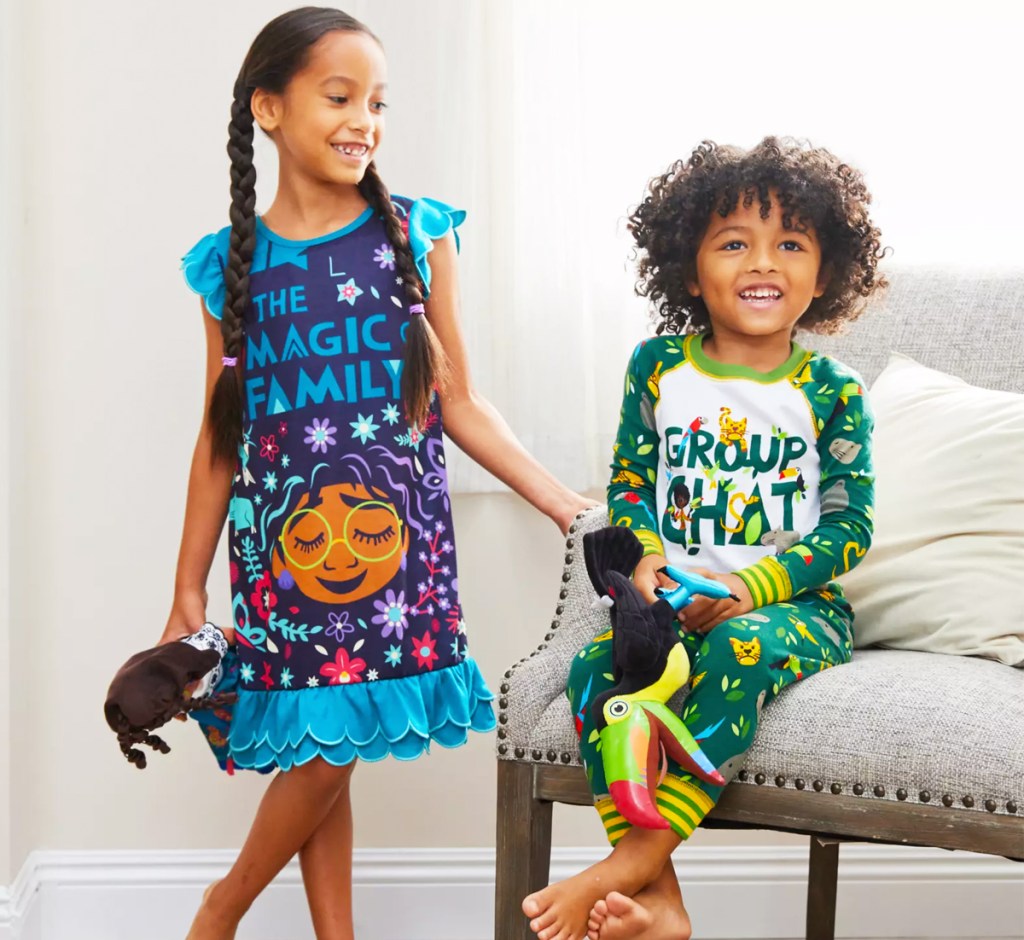 two kids wearing disney pajamas