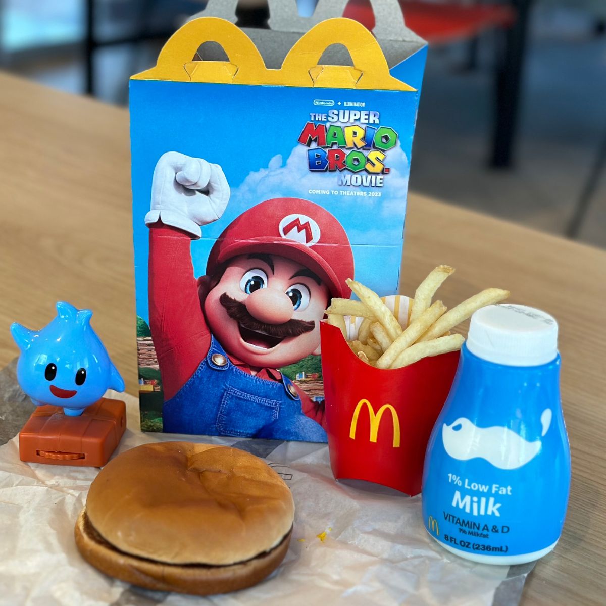 Mario happy meal opened up and spread on a table 