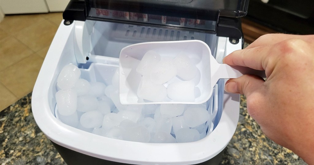 scooping ice from ice maker