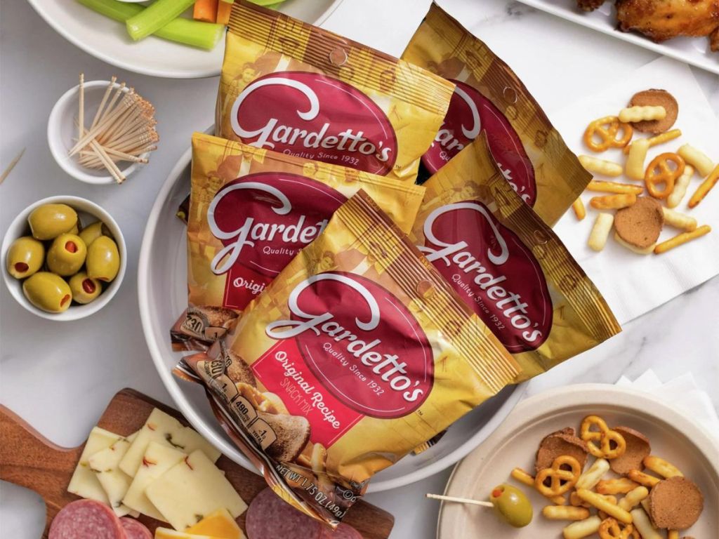Gardetto's Snack Bags in a bowl on a table surrounded by snacks