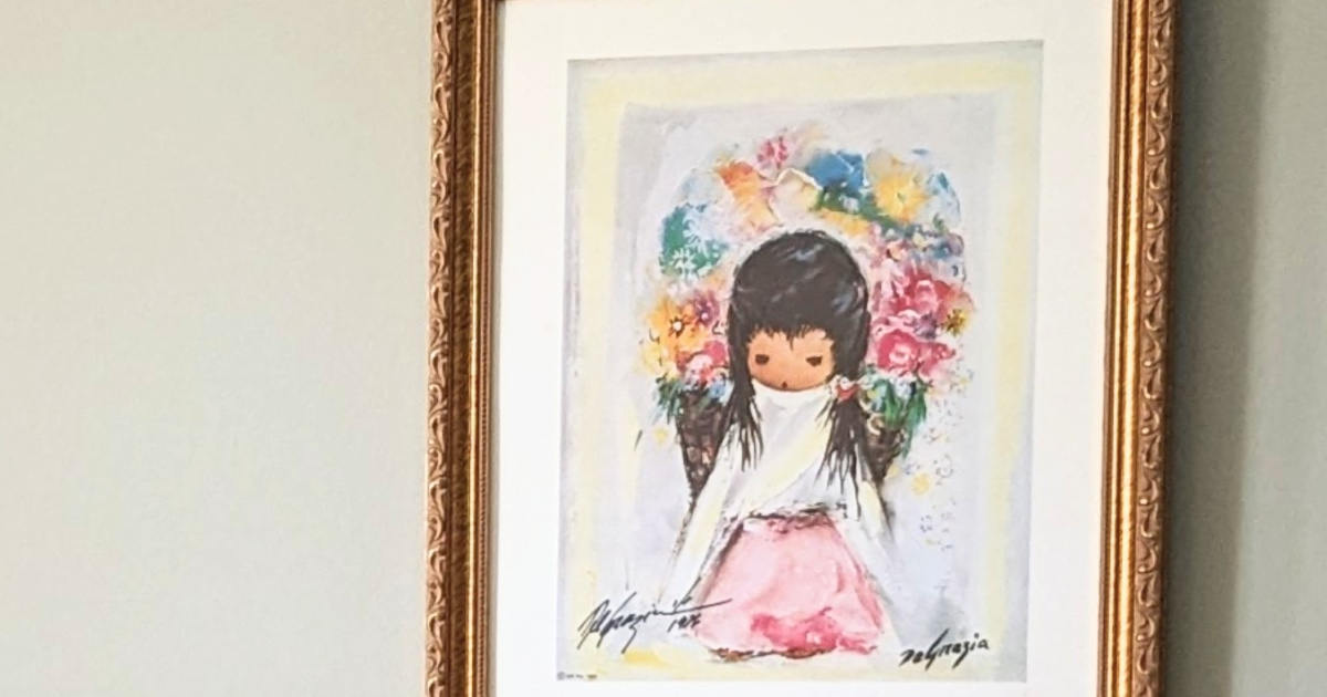 framed artwork of a girl 