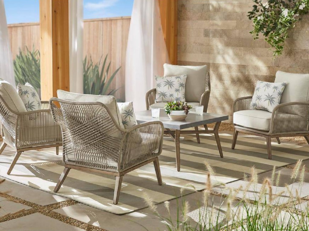 Hampton Bay Haymont 5-Piece Outdoor Patio Deep Seating Set w_ Beige Cushions with a rug outside