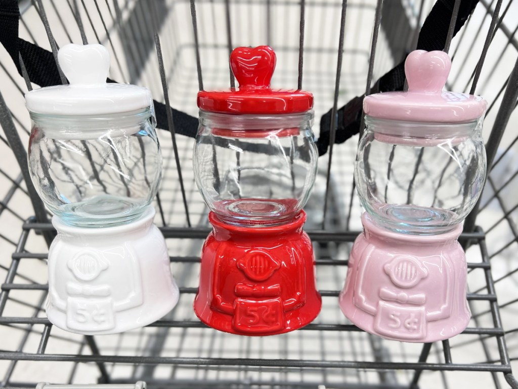 white, red, and pink gumball machine decor pieces in shopping cart