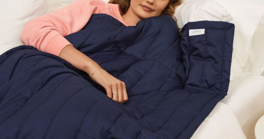 Woman sleeping with a Casper weighted blanket in indigo