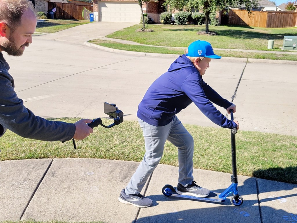 using gimbal to shoot video of boy on scooter