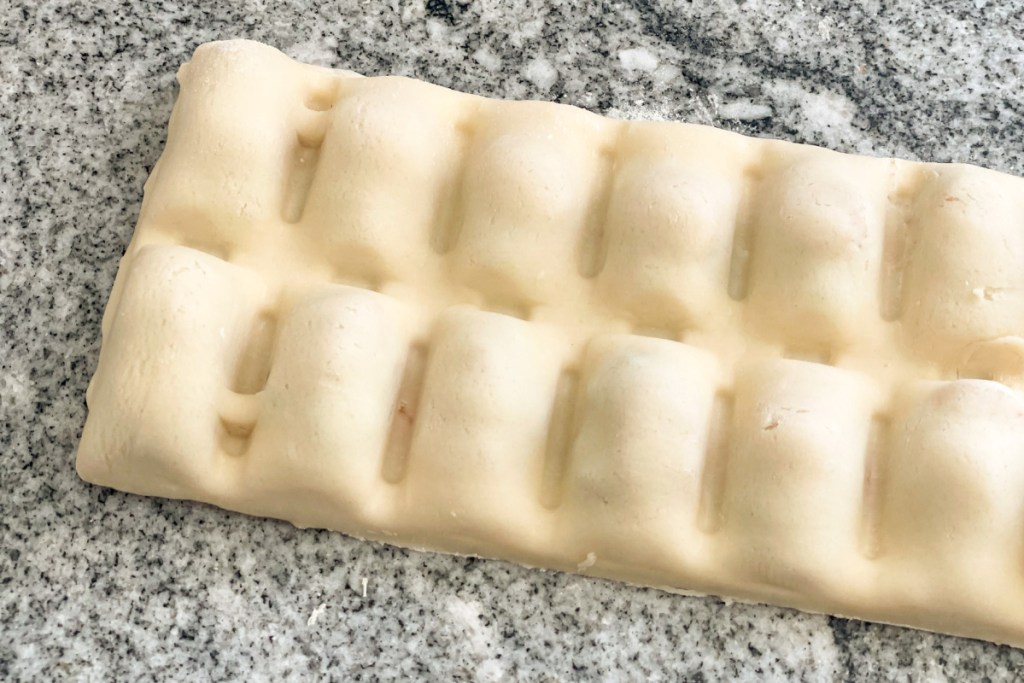 homemade pizza dough bites flipped out of ice cube tray