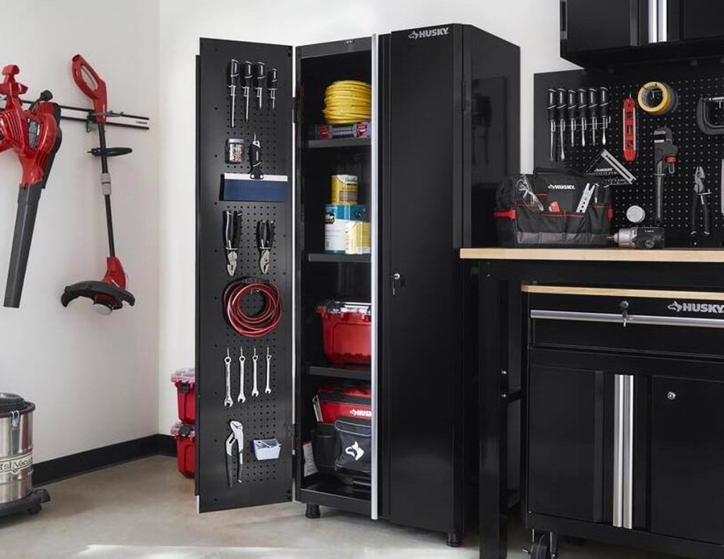 tall black cabinet filled with tools in garage