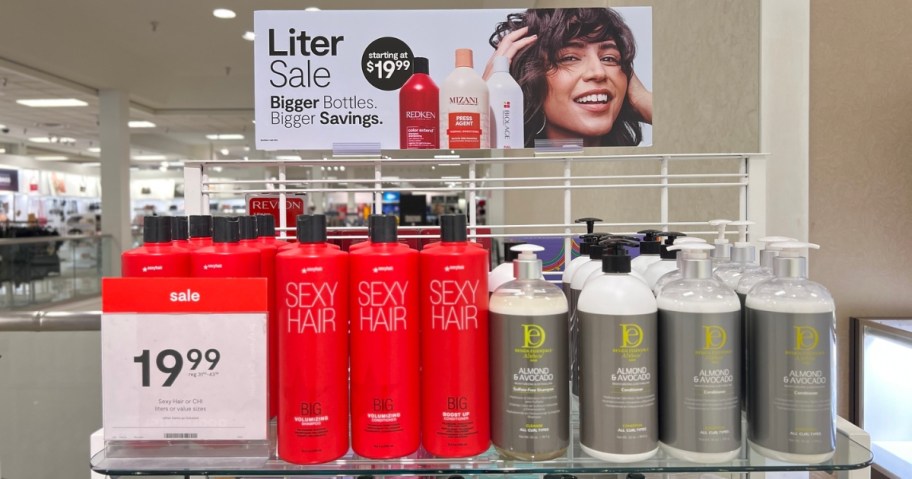 jcpenney hair care liter sale in store - shampoo bottles on display shelf with signage