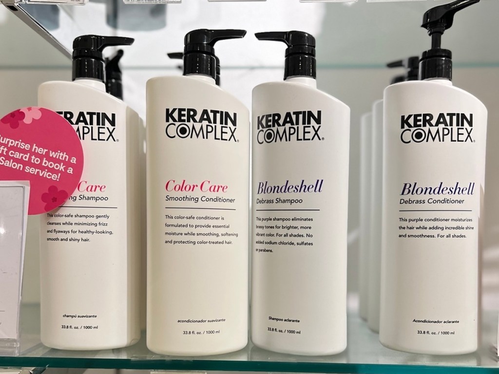 liter bottles of Keratin Complex Shampoo & Conditioner on glass shelf