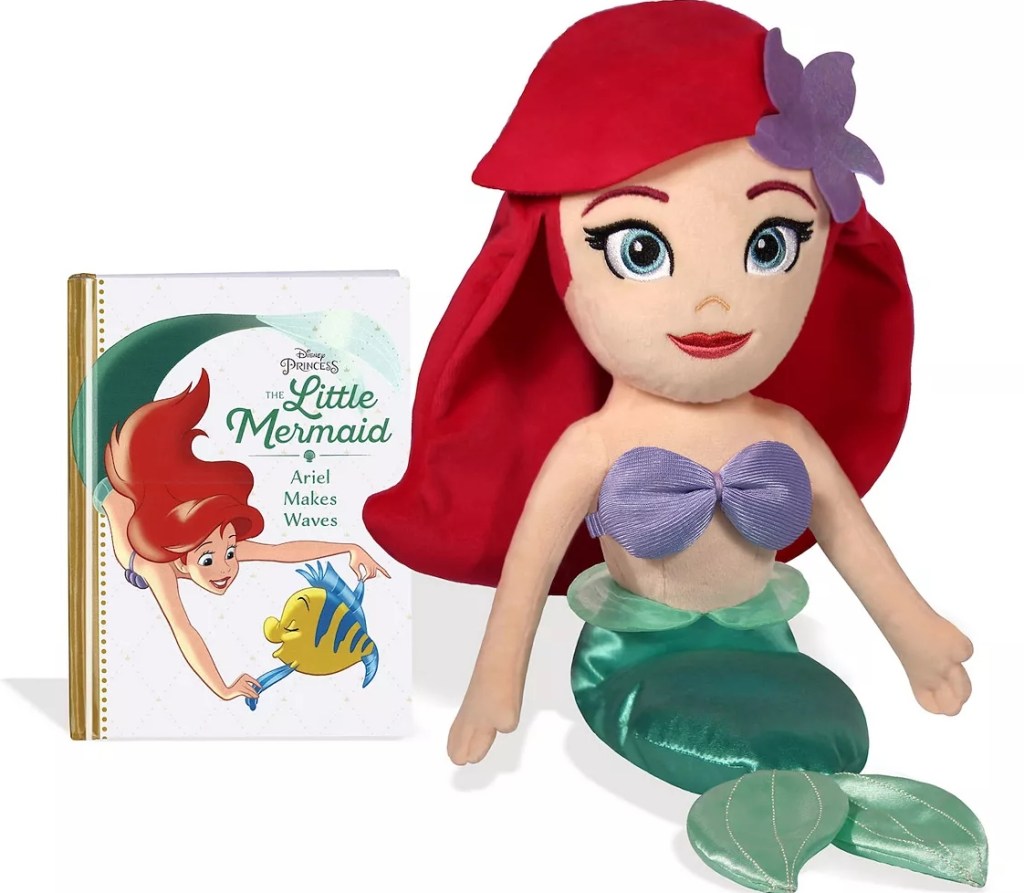 The Little Mermaid book and a plush Ariel toy