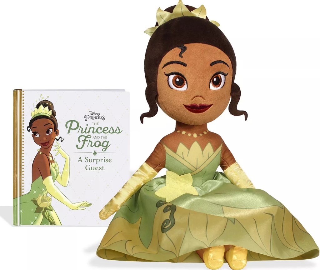 The Princess and the Frog book and a plush Tiana toy