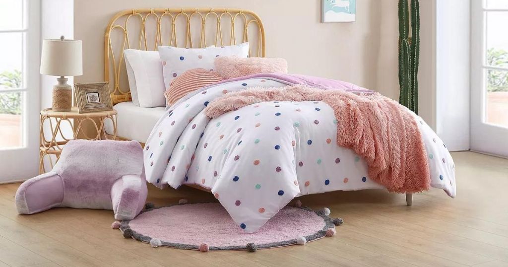 polka dot comforter on bed in bedroom