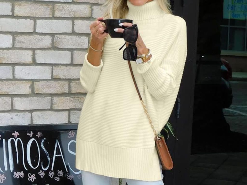 A woman wearing a Women's Oversized Turtleneck Sweater
