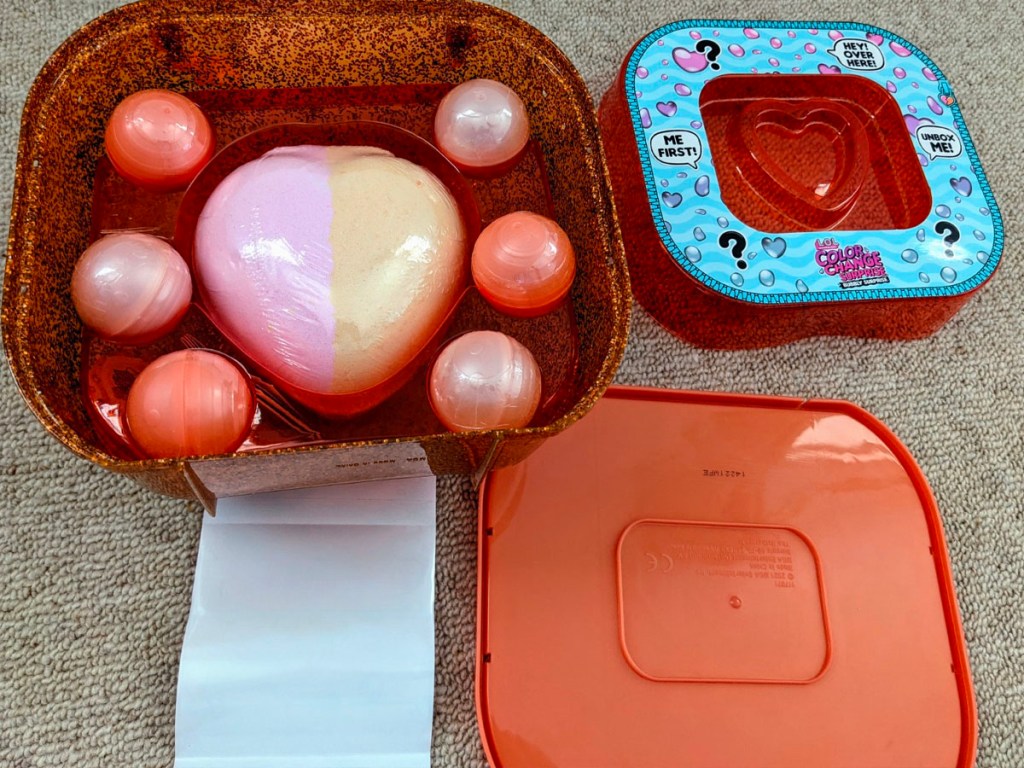 orange LOL surprise bubbly case open on floor