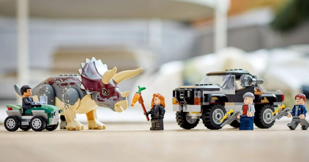 lego dinosaur and vehicle set
