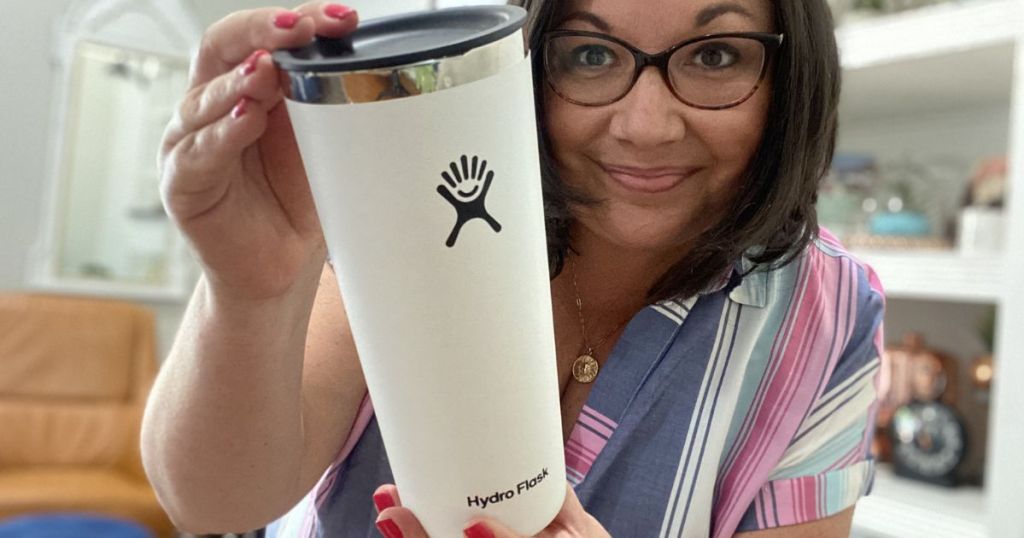 Woman holding a hydro flask tumbler