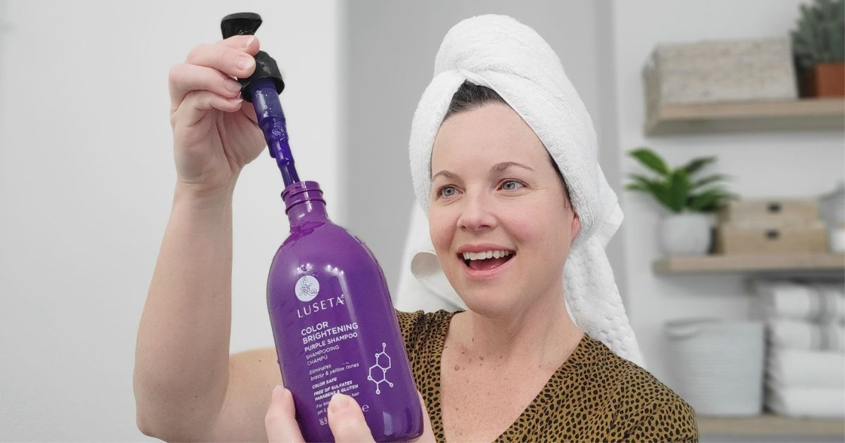 woman holding Luseta Purple Shampoo
