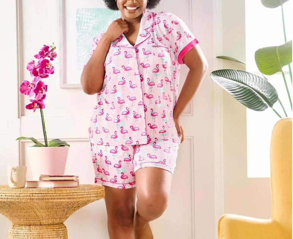 Woman standing up wearing Muk Luks pajamas in flamingo print