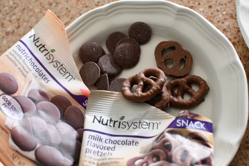 A plate of nutrisystem desserts like chocolate covered pretzels.