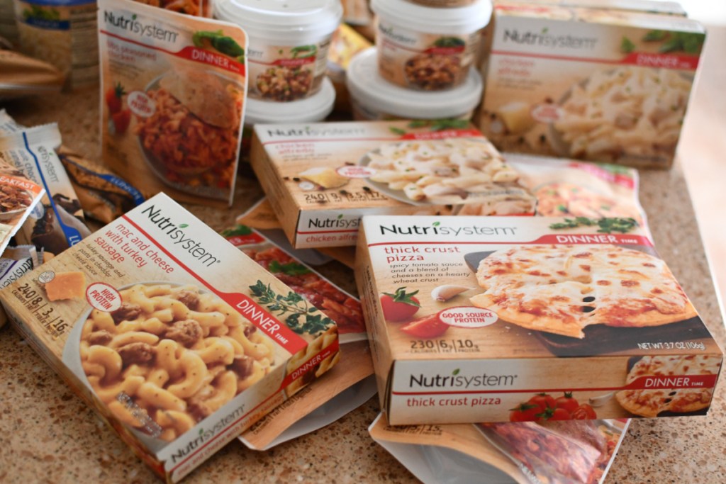 Several Nutrisystem Meals on a counter