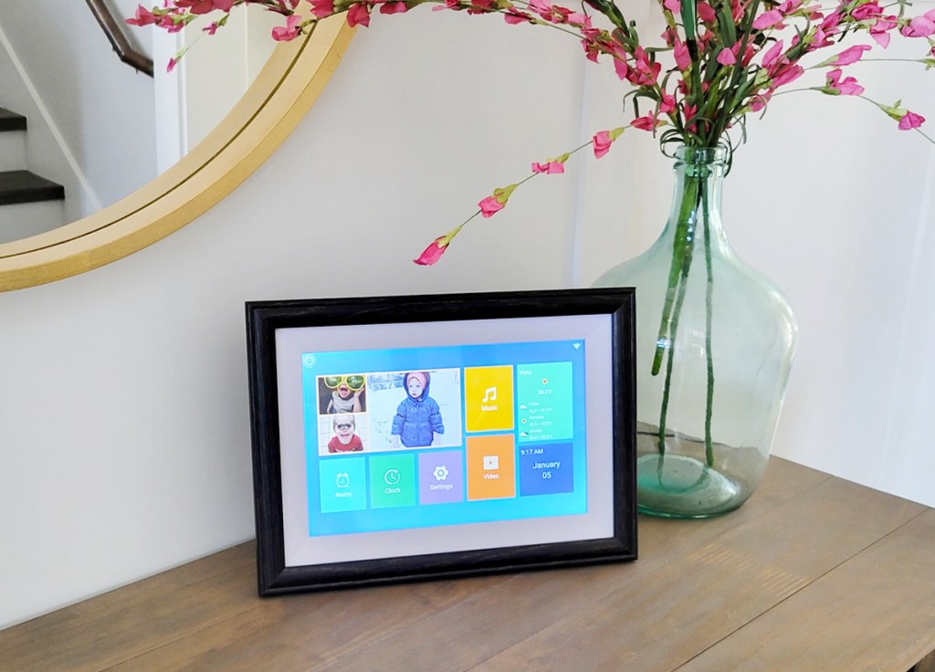 digital picture frame on wood table