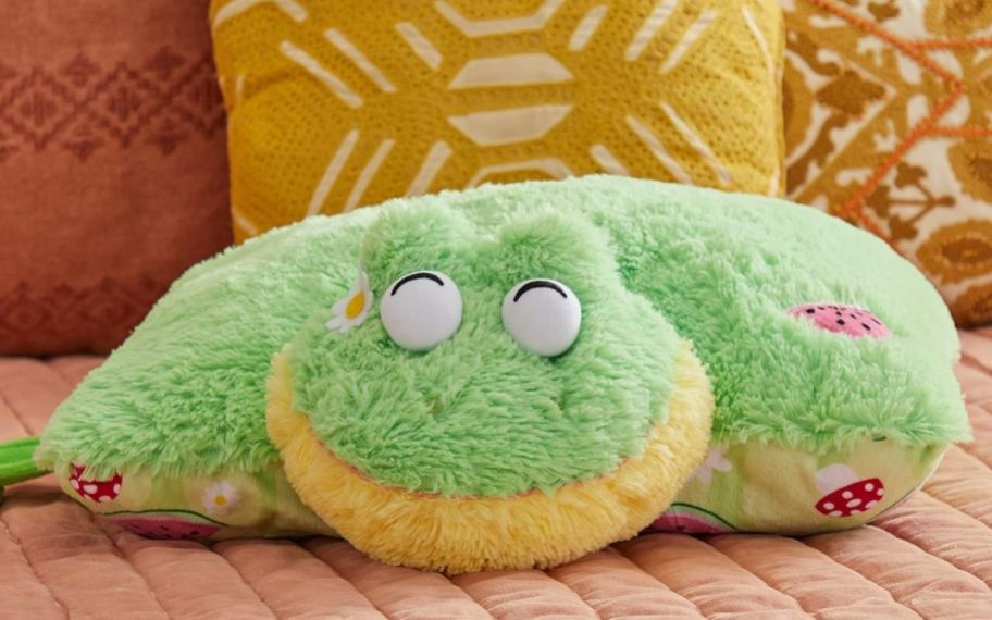 a Pillow Pets Sweet Frog Stuffed Plush on a sofa
