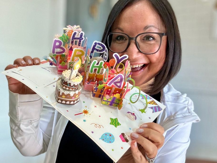 Woman holding a pop-up birthday card