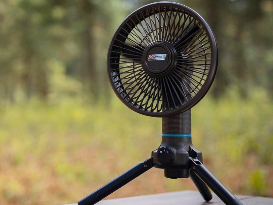 Portable fan displayed on top of a table outside