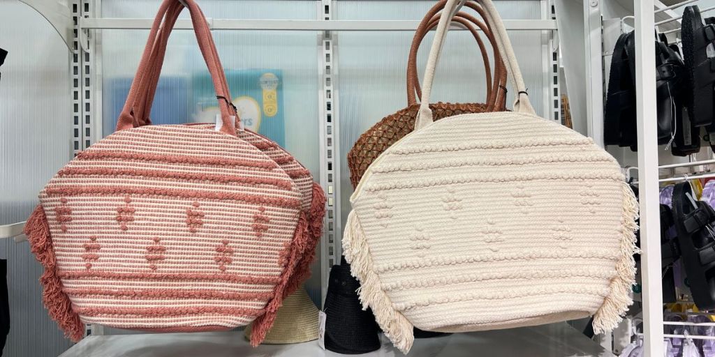 pink fringe handbag and white fringe handbag